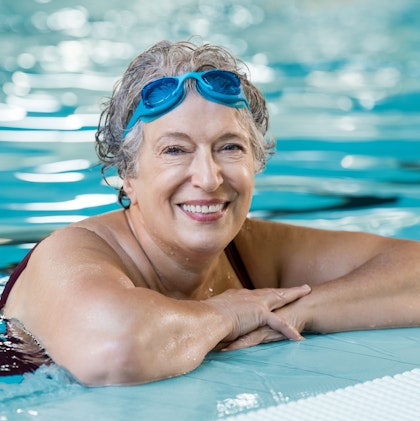 smiling senior woman in pool