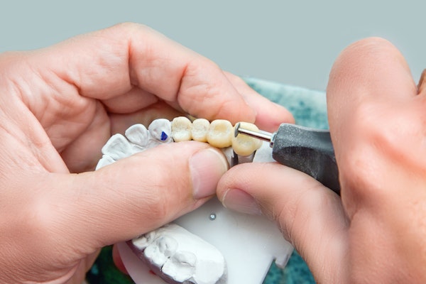dentist creating dental bridge