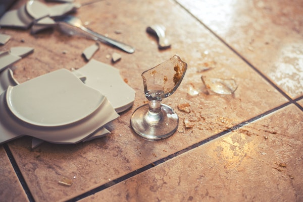 broken plate and glass on the floor