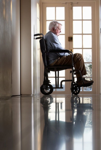 Sad older man in a wheelchair