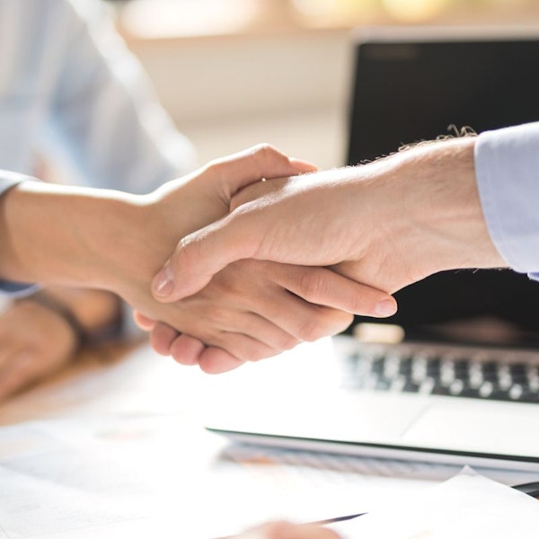 Business partners shaking hands