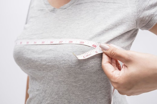woman measuring her bust