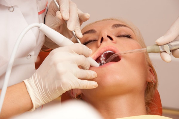 Woman undergoing dental treatment