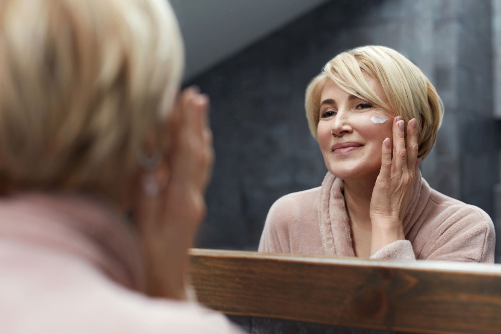Woman applying SkinMedica®