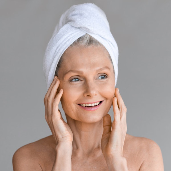 Smiling woman after Traditional Facelift