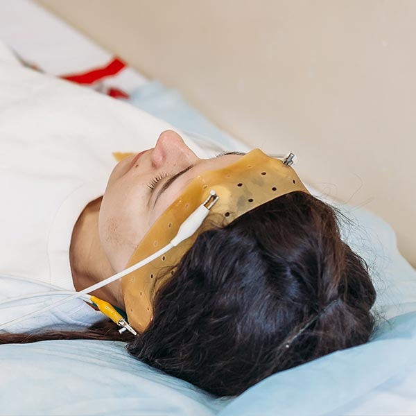 Woman at hospital doing sleep study test