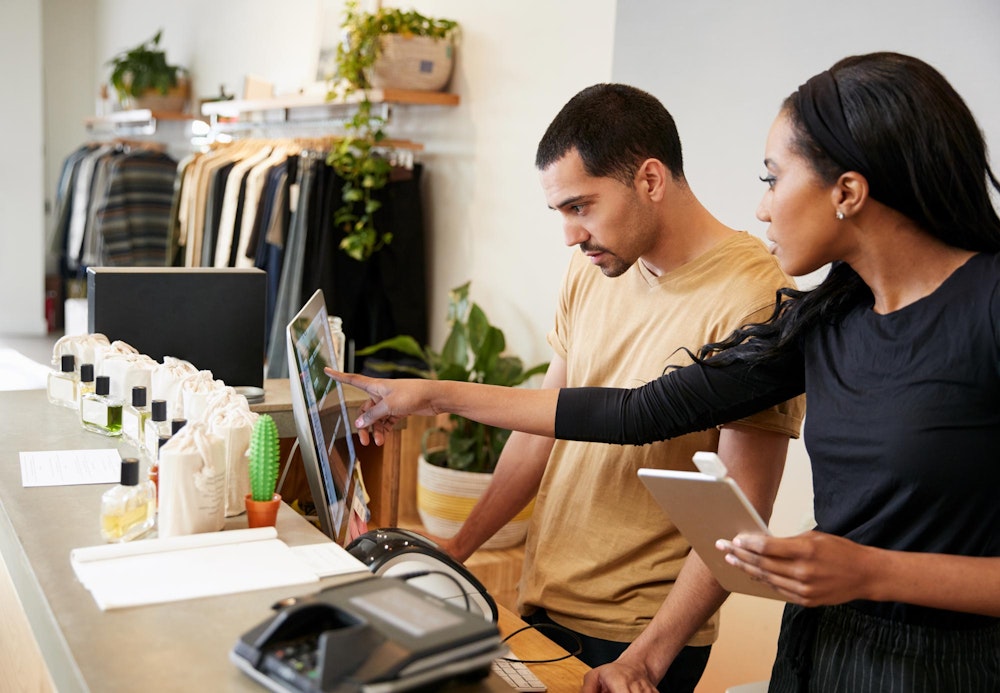 Small business workers looking at computer