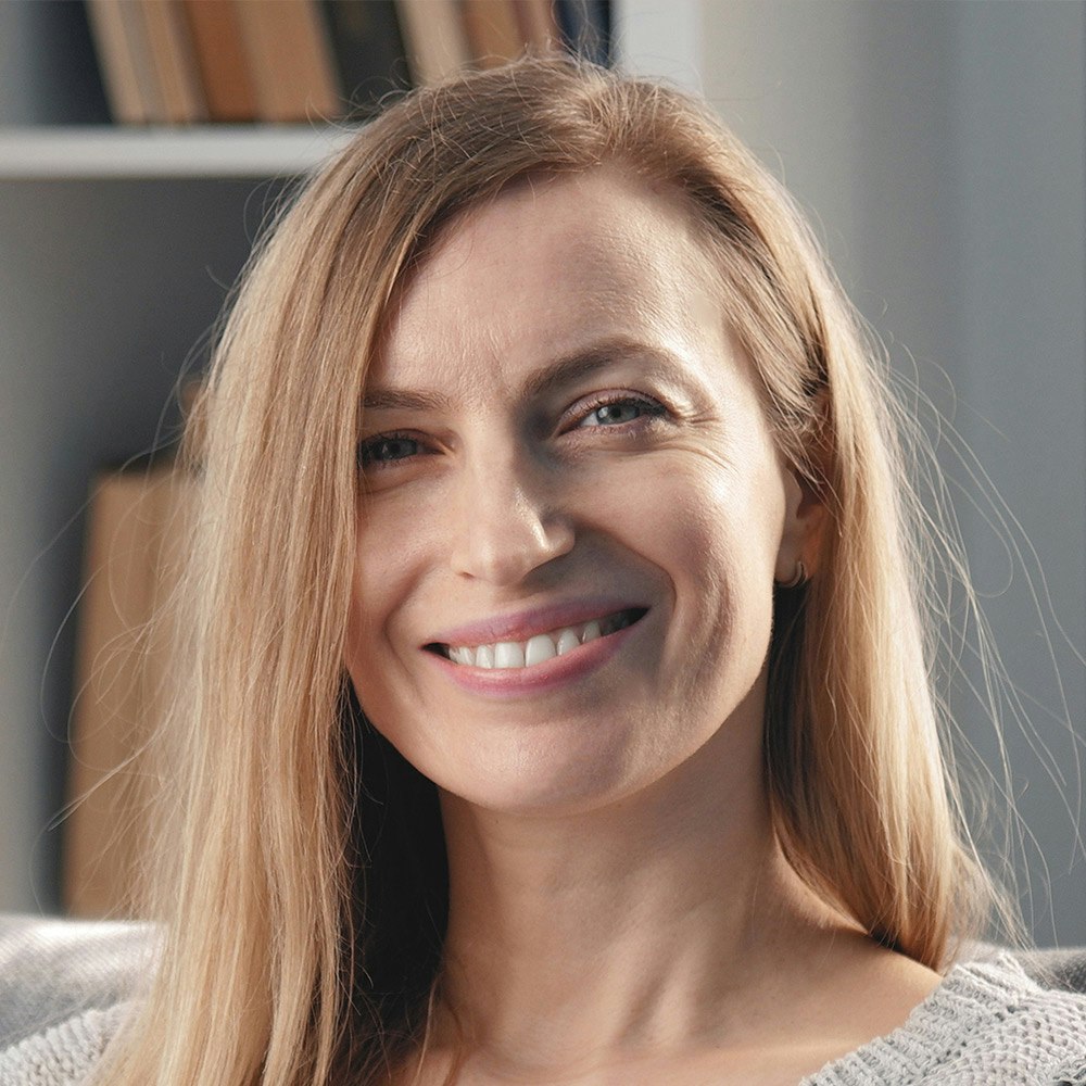 Smiling woman with dental crowns