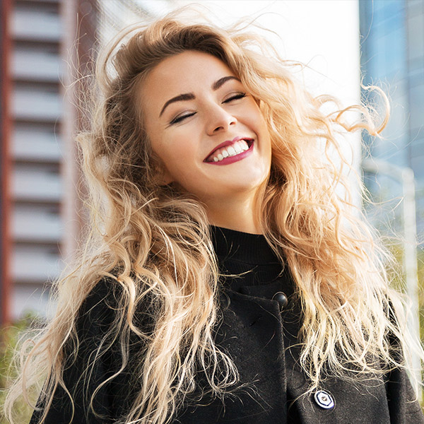 Smiling young woman in the city