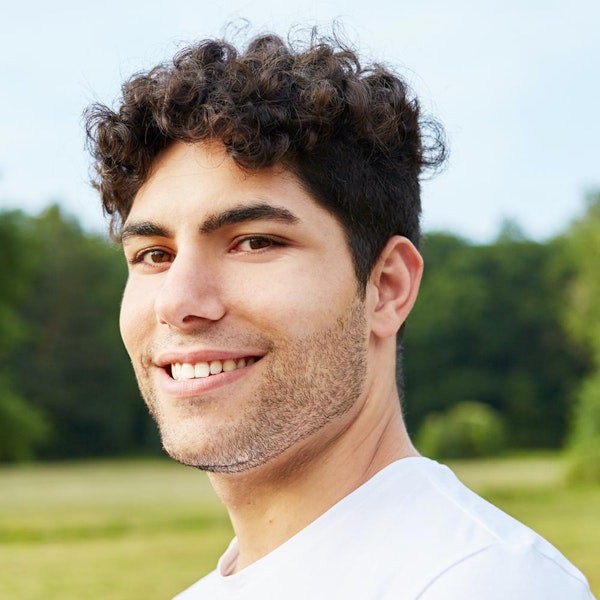 Smiling man with pinned ears