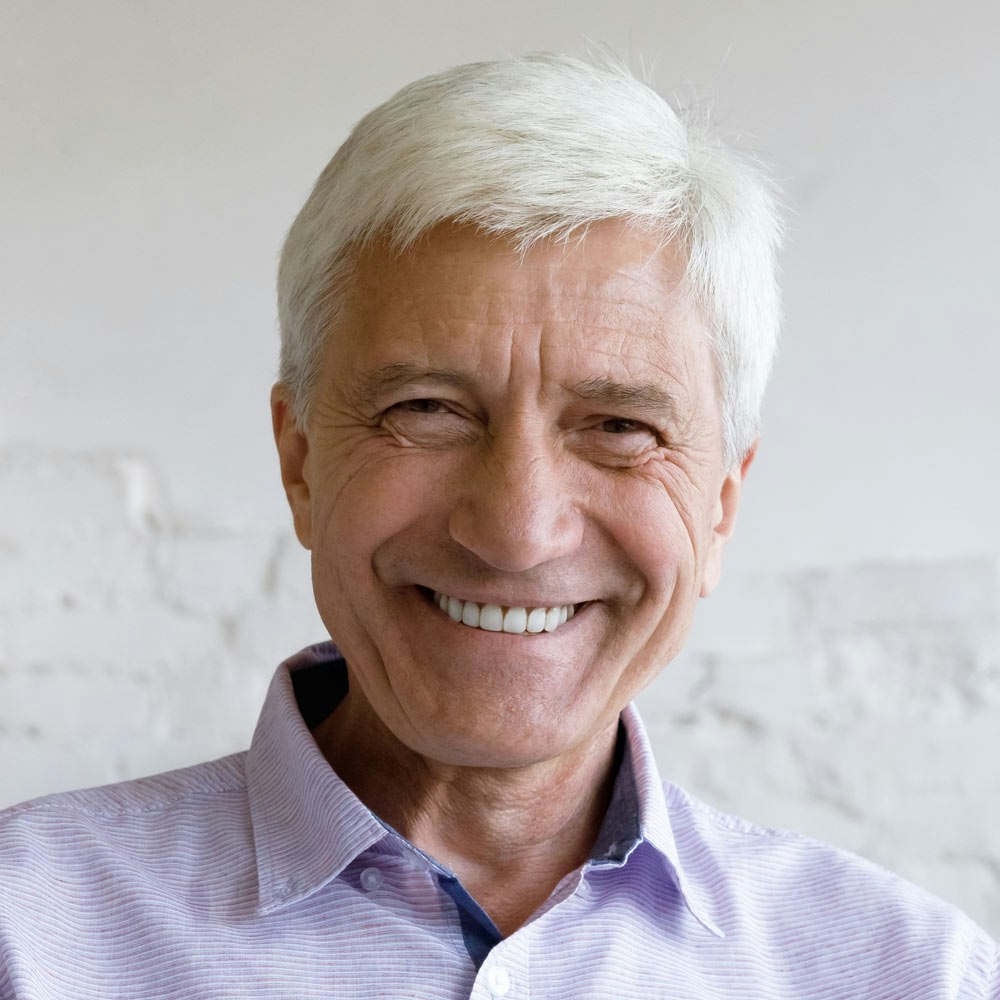 Smiling mature man after full mouth reconstruction