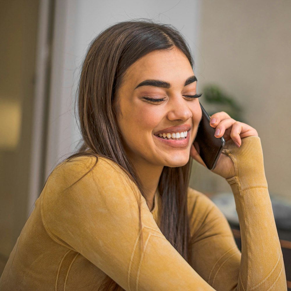 Smiling woman talking on the phone