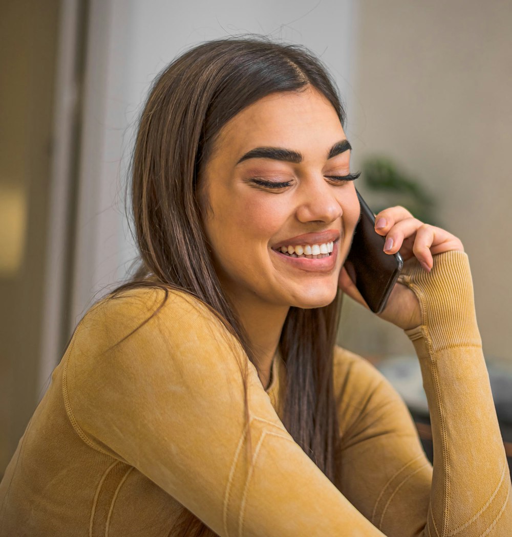 Smiling woman talking on the phone