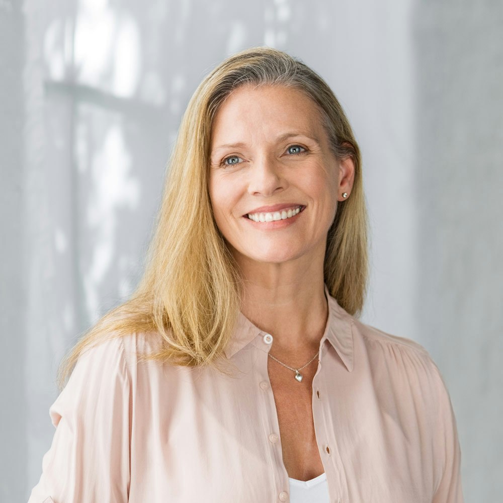 Smiling woman after Dental Bonding