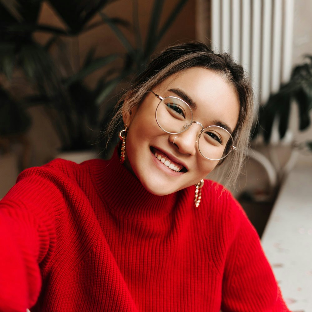 Smiling young woman wearing eye glasses
