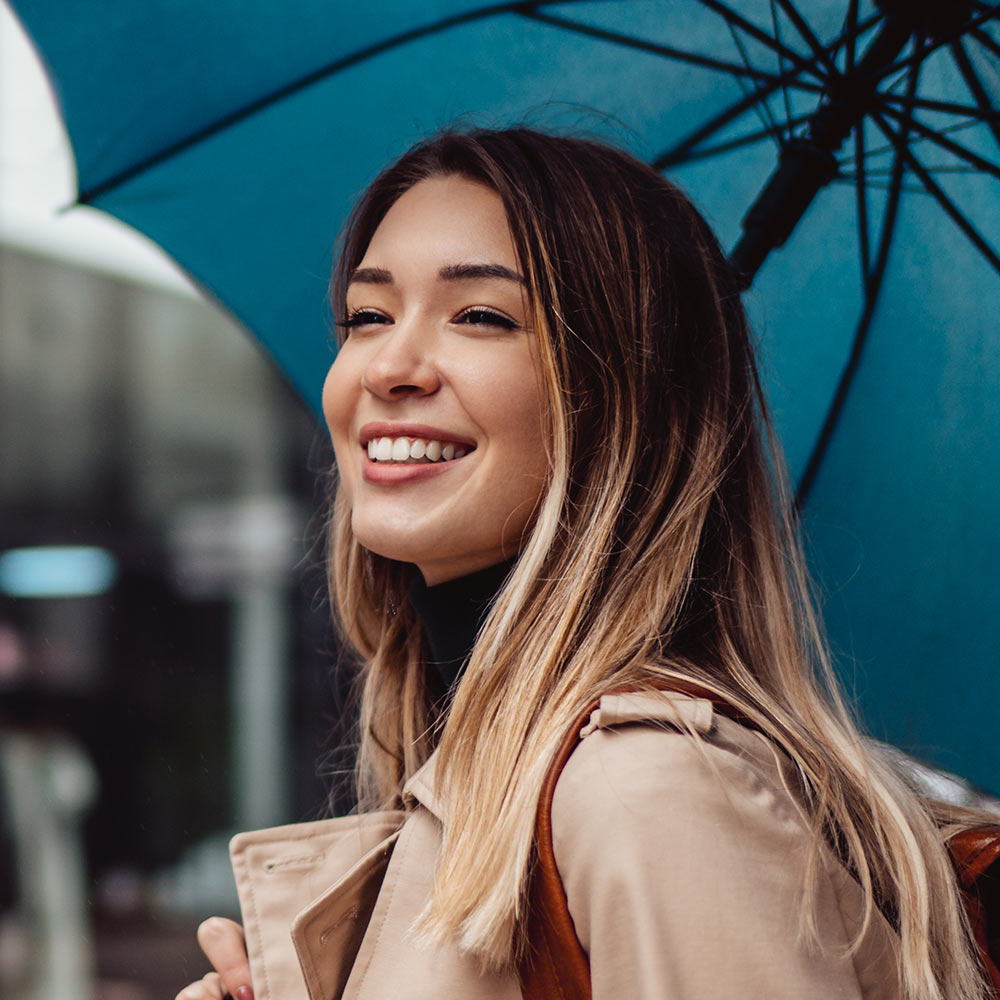 Smiling woman with umbrella