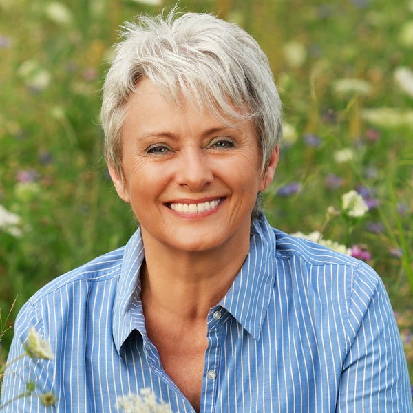 woman sitting outside and smiling