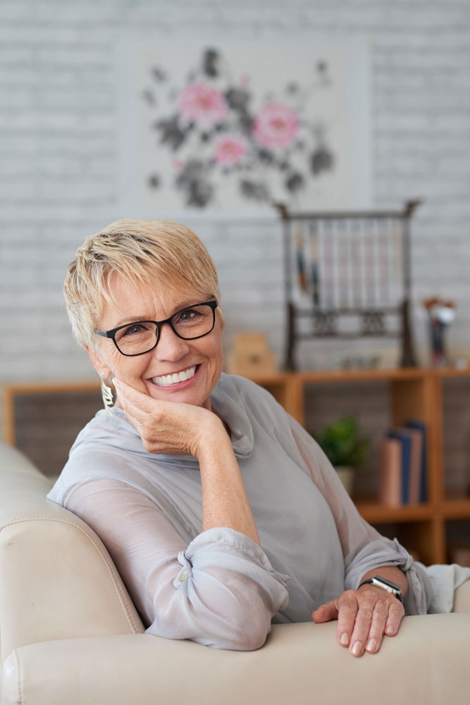 Smiling mature woman wearing glasses