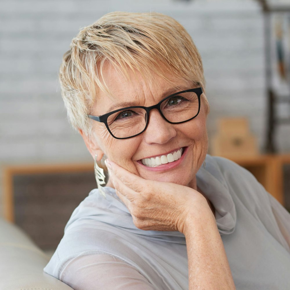 Smiling mature woman wearing glasses
