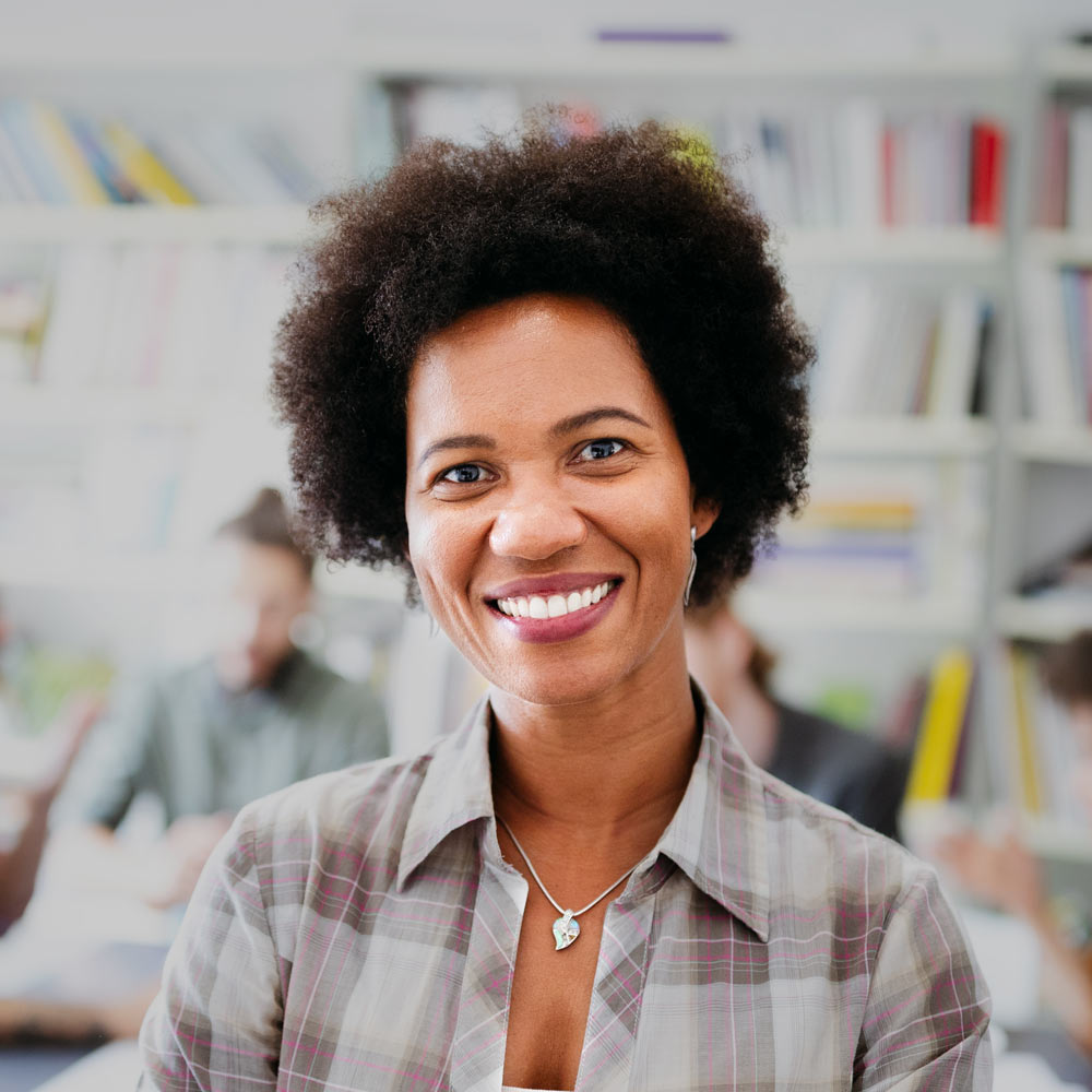 Smiling mature woman at work after a tooth extraction
