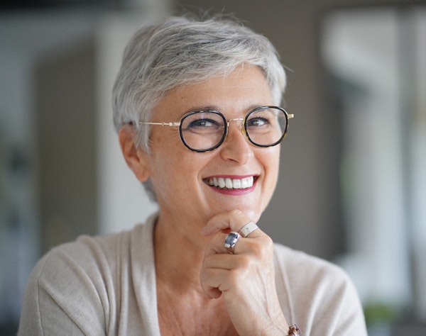 Smiling woman after gum contouring