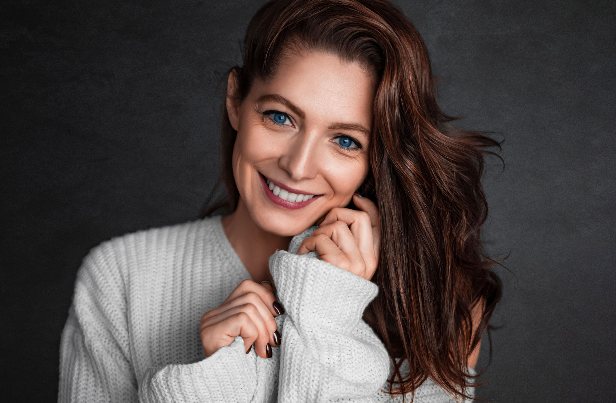 Woman in a sweater with good skin