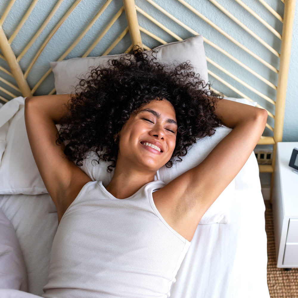 Happy woman waking up