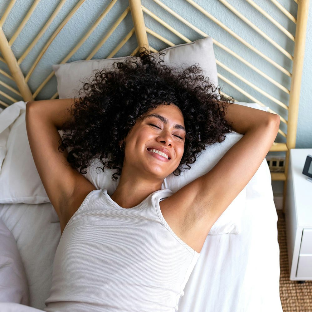 Happy woman waking up