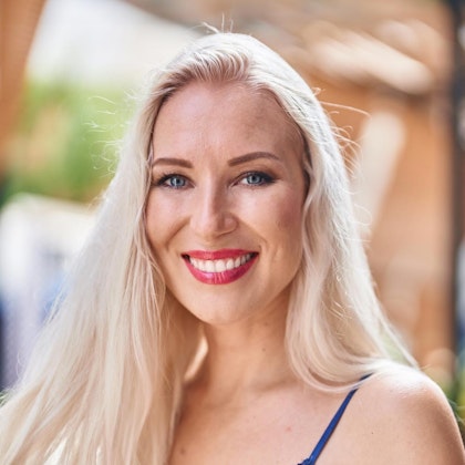 Smiling woman outdoors with brow lift