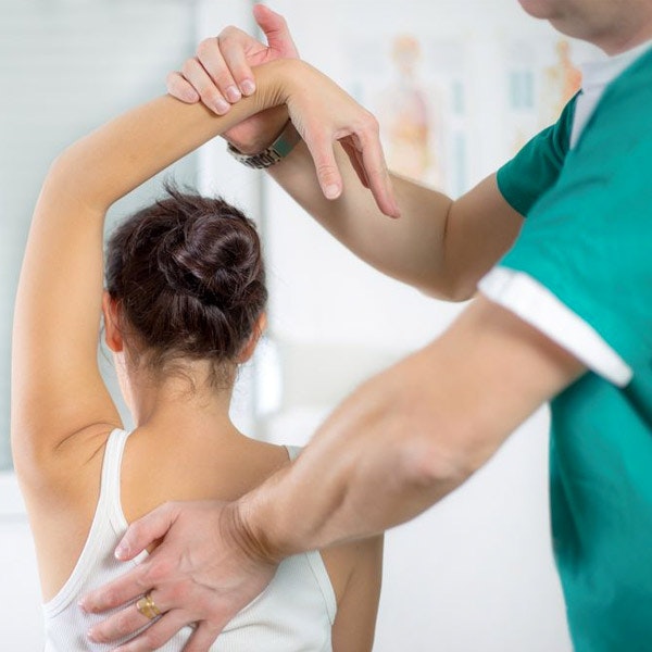 Woman undergoing physical therapy