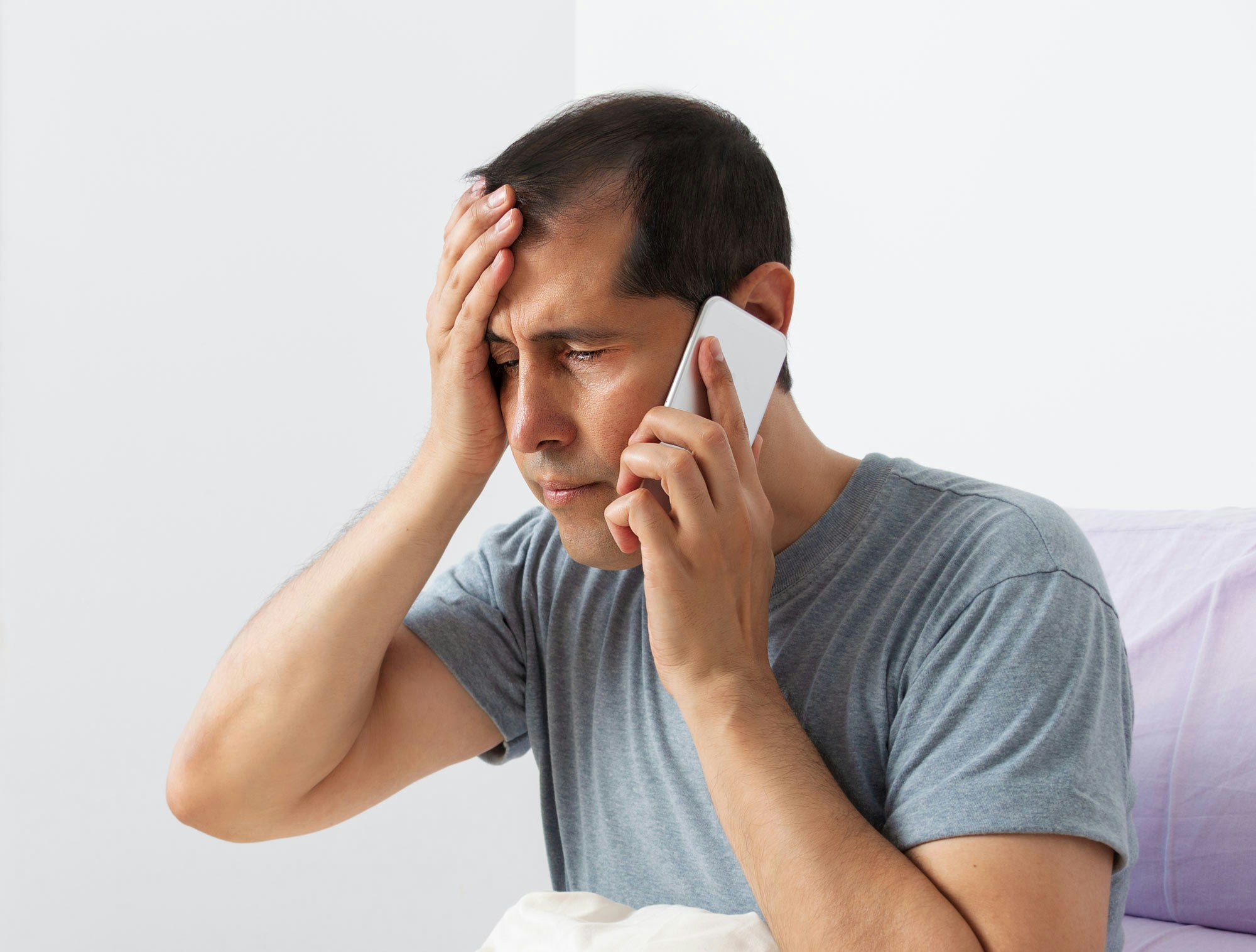 Stressed man on phone call