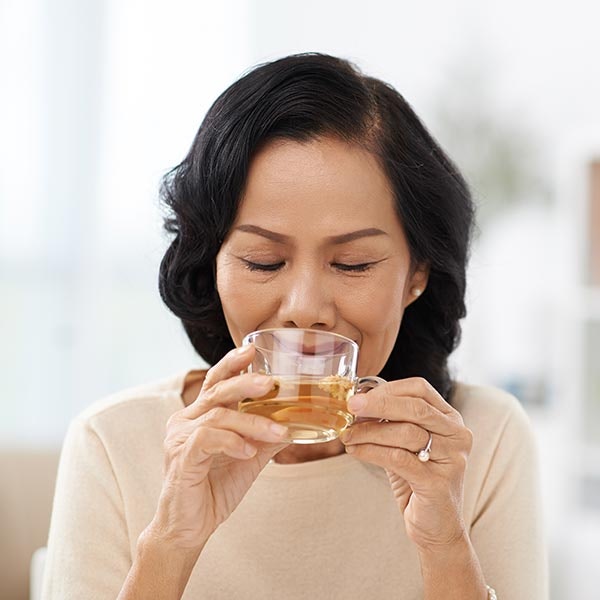 Woman sipping tea