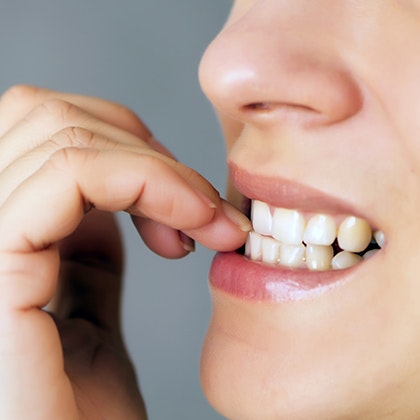 touching loose tooth