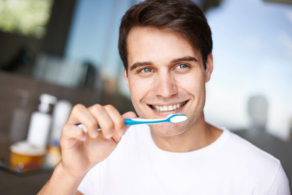 Man brushing teeth