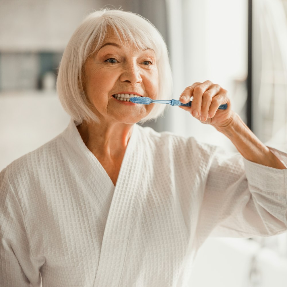 Woman brushing teeth