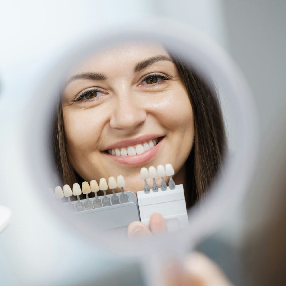 Porcelain Veneers and woman in mirror