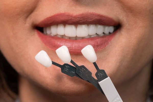 Woman comparing different porcelain veneers