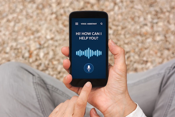 Voice Assisted Technology on phone reading "HI! HOW CAN I HELP YOU?"