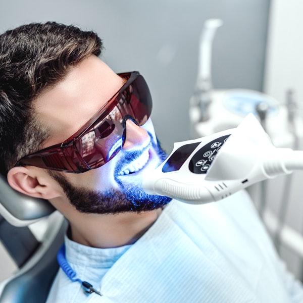 Person undergoing teeth whitening