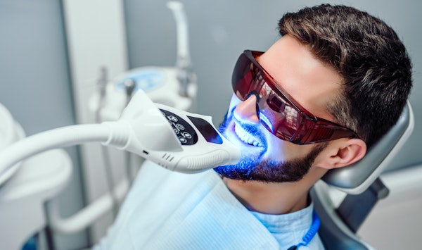Man getting teeth whitening treatment