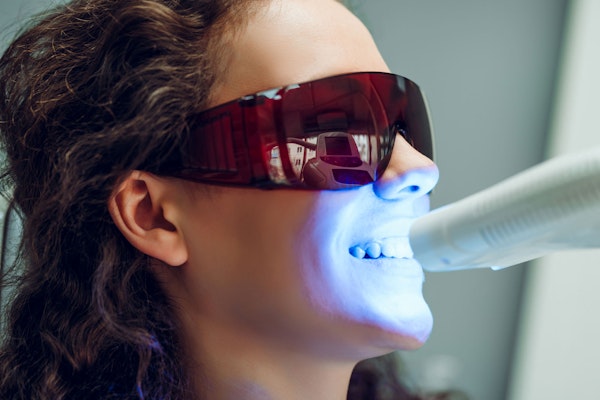 Women receiving teeth whitening treatment