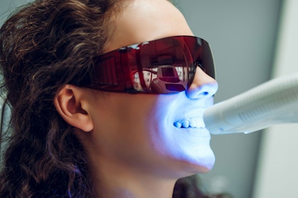 Patient getting teeth whitening treatment