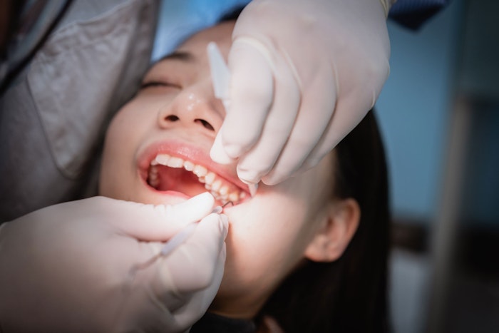 Patient receiving teeth cleaning